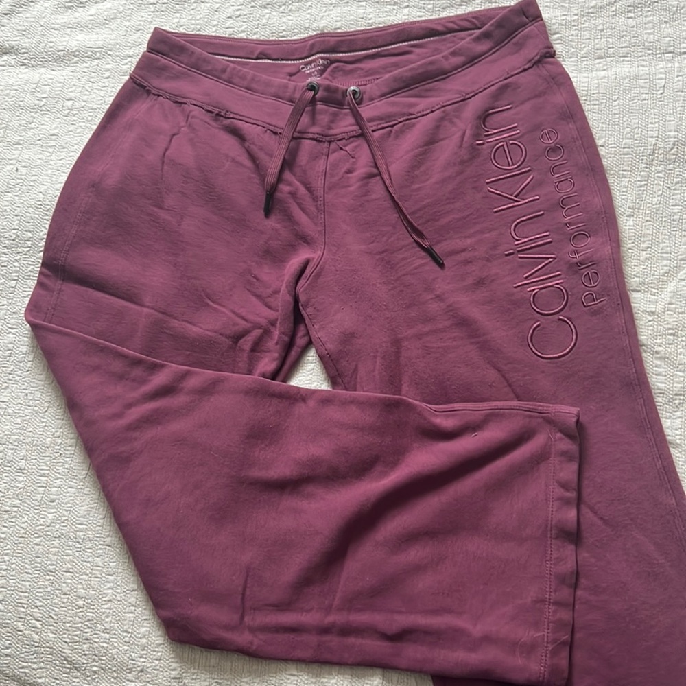 Purple Calvin Klein straight leg sweatpants.